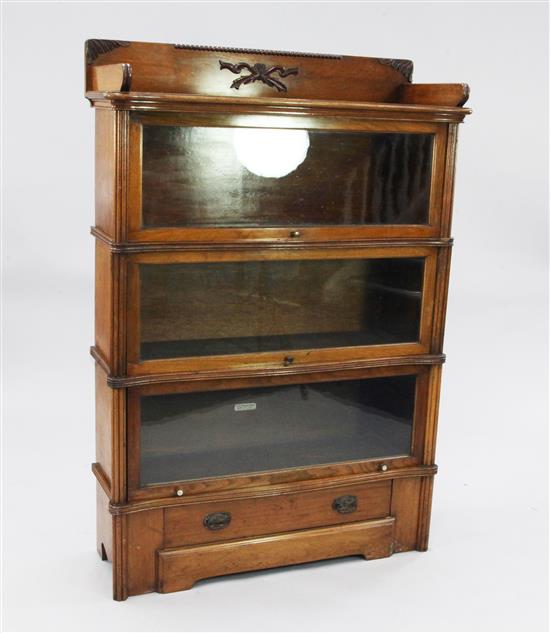 An Edwardian walnut three tier sectional bookcase, W.3ft 1in.